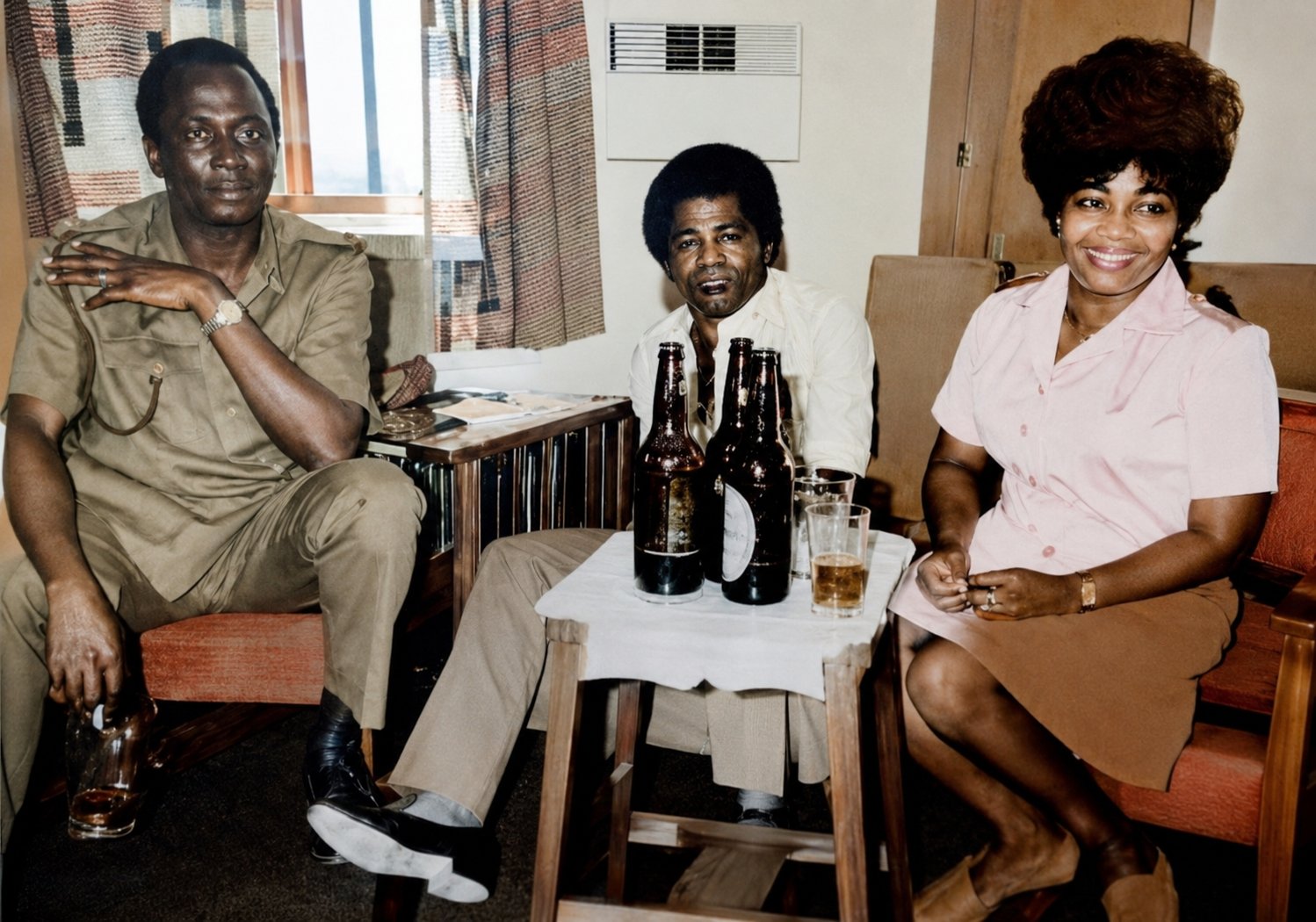 Col. Oludipe Thomas, James Brown, and Lucrezia Modupe Domingo, also fondly known as "Dupe Soldier", pictured in 1970 during James Brown's historic tour of Nigeria. The visit came at a significant moment, as the American "Godfather of Soul" connected with his African roots just as the Nigerian Civil War had ended.